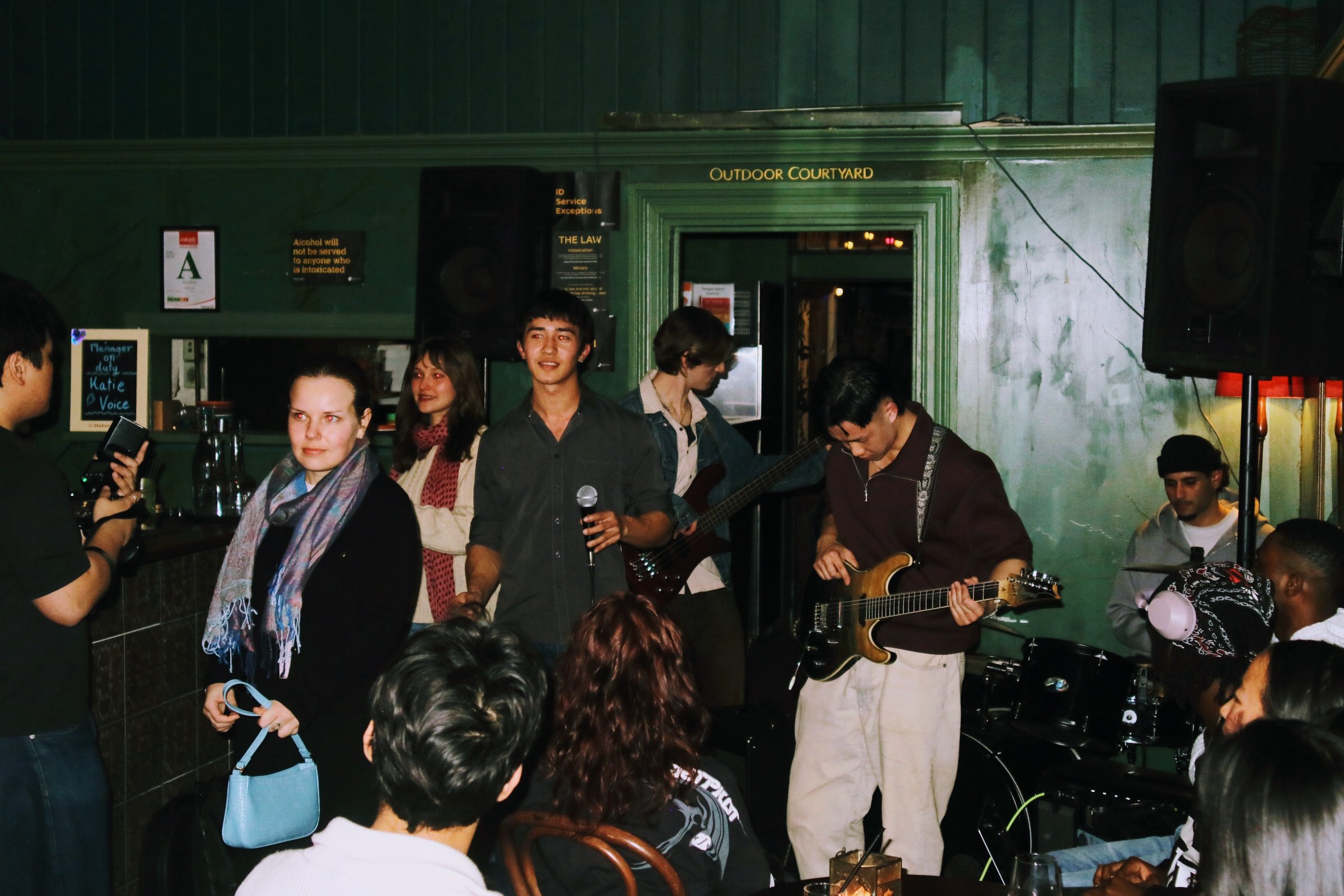 KC performing live on guitar